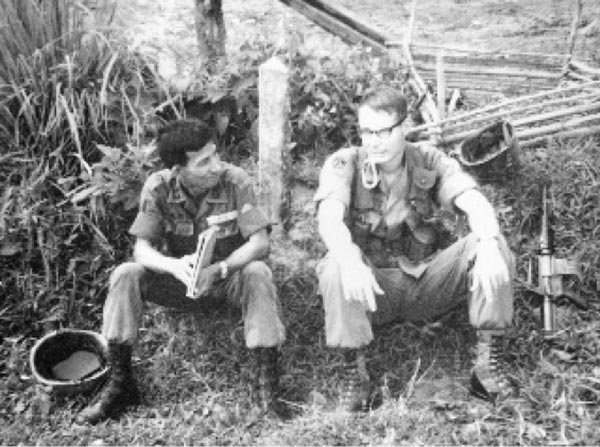 RF/PF adviser with counterpart in Binh Duong Province, 1969.